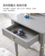 Modern white dressing table with mirror and stool in a bedroom setting