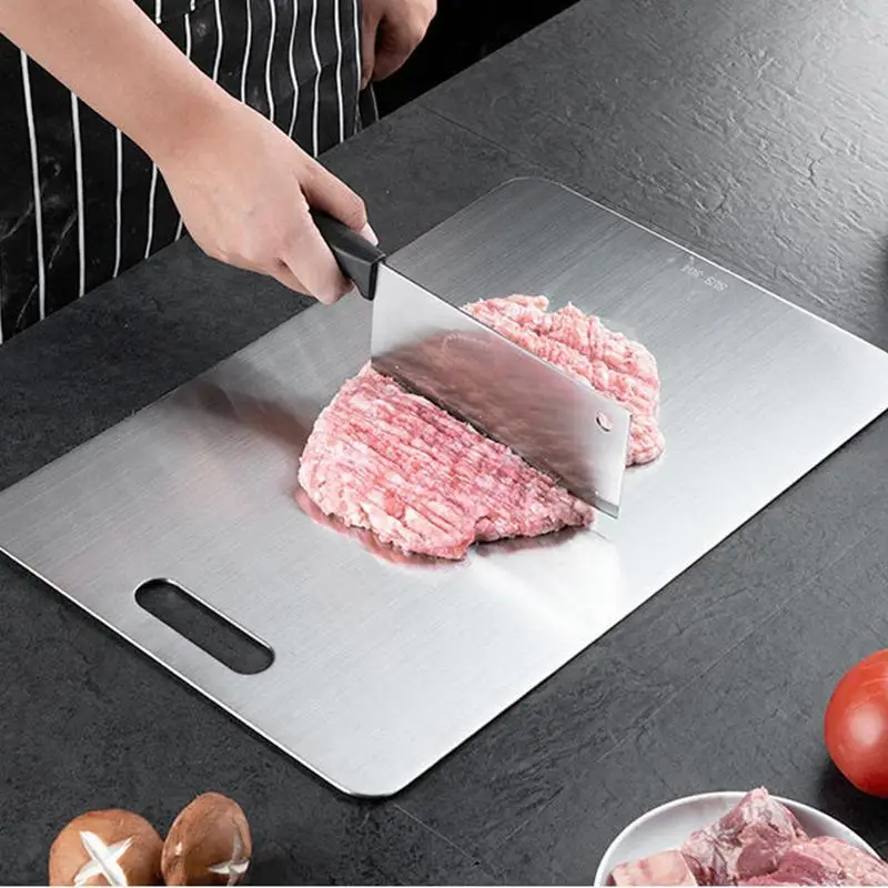 Double thick titanium cutting board with juice groove on a kitchen countertop