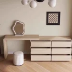 Modern vanity table with mirror and drawers in a bedroom setting