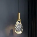 Modern crystal pendant lamp illuminating a dining room with elegant light refraction