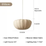 Wabi sabi pendant light hanging over a wooden dining table in a cozy room