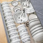 Elegant 20-piece porcelain dinnerware set arranged on a table, showcasing bowls and plates in a gift box