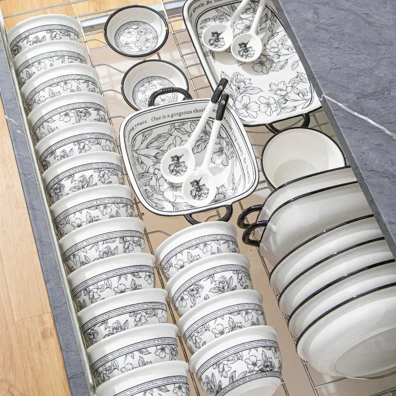 Elegant 20-piece porcelain dinnerware set arranged on a table, showcasing bowls and plates in a gift box