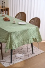 French country tablecloth with retro plaid pattern and lotus leaf edge on a dining table