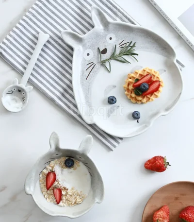 Colorful kids ceramic bowl set with four bowls featuring cute animal designs