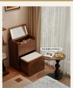Wooden makeup vanity with mirror and stool in a modern bedroom setting
