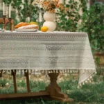 Retro polka dot tablecloth with fringe on a wooden table