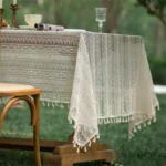 Retro polka dot tablecloth with fringe on a wooden table