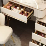 French white wooden dressing table with mirror and stool in a modern bedroom setting