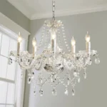 Elegant crystal chandelier illuminating a modern living room with sparkling light