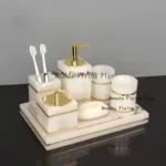 Marble soap dish with gold rim, empty and clean.