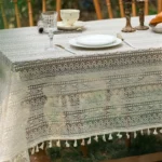 Retro polka dot tablecloth with fringe on a wooden table