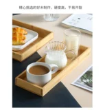 Elegant bamboo serving tray with Japanese-style square design, perfect for serving tea or fruit
