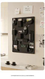 White desk organizer shelf with books and office supplies on a wooden desk