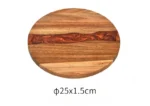 Round acacia cutting board with resin inlay on kitchen counter