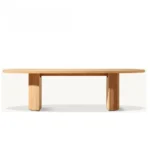 French retro oval dining table with natural wood top and teak base in a dining room setting