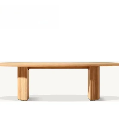 French retro oval dining table with natural wood top and teak base in a dining room setting