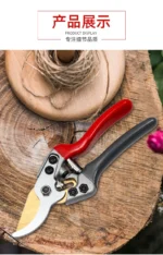 Goldoma pruning shears with a branch being cut, focus on the sharp blade.