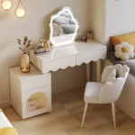 Modern makeup vanity desk with mirror and stool in a bedroom setting, showcasing ample storage and elegant design