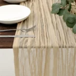 Rustic cheesecloth table runner on wooden table with boho decor