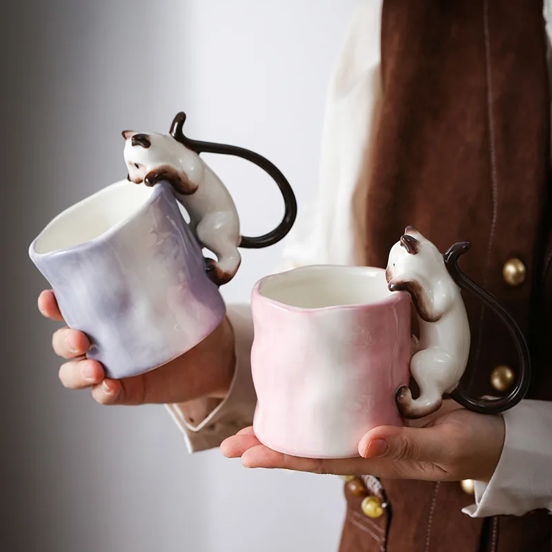 3D cat mug with embossed cat design on white ceramic