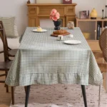 French country tablecloth with retro plaid pattern and lotus leaf edge on a dining table