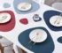 Elegant leather placemats set on a dining table with coasters