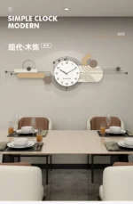 Clock with a matte white frame and subtle shadow on a pastel pink wall in a bedroom.