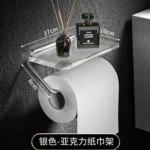 The punch-free toilet paper roll holder mounted on a glass tile backsplash in a contemporary kitchen.