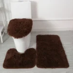Plush bathroom rug set with toilet lid cover and mat in a cozy bathroom