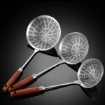 Three sizes of 304 stainless steel strainer with long handles on a kitchen counter