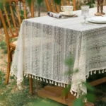 Retro polka dot tablecloth with fringe on a wooden table