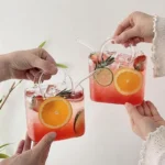 Korean ins style handbag shaped glass cup with straw on table