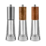 Manual pepper grinder with acrylic body and ceramic core on kitchen counter