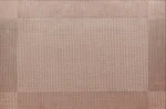 Gold weave placemats on a dining table with plates and cutlery