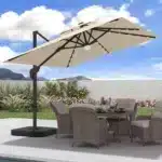 Goldoma large patio umbrella with lights illuminating a 9x9 FT square cantilever umbrella with solar LED lights in a bac