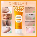 Goldoma orange face scrub jar held in hand, showing product label and orange cream consistency.