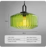 Modern colored glass pendant lamp illuminating a cozy dining room with vibrant hues
