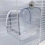 Close-up of the clear plastic bird bathing tub showing its nonspill design.