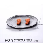 Black melamine dinner plates stacked elegantly on a wooden table
