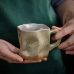 Japanese simple stoneware coffee cup on wooden table