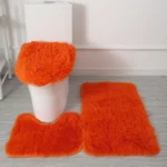 Plush bathroom rug set with toilet lid cover and mat in a modern bathroom