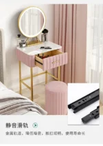 Marble top dressing table with lighted mirror and stool in a bedroom setting