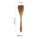 Wooden cooking utensils set with spatula, soup ladle, and rice scoop on a kitchen counter