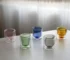 Clear double wall insulated glass mug with espresso coffee on wooden table