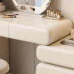 Modern cream dressing table with storage drawers and mirror in bedroom setting
