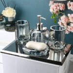 Toothbrush holder cup with blue toothbrush.