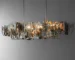 Modern chandelier for kitchen hanging over a kitchen island with metal fragment design