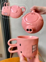 Funny pig teapot pouring tea from its snout on a kitchen counter