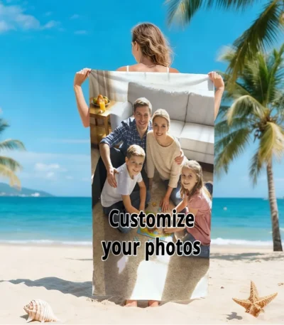 Custom photo beach towel with a vibrant family photo, lying on the sand near the ocean